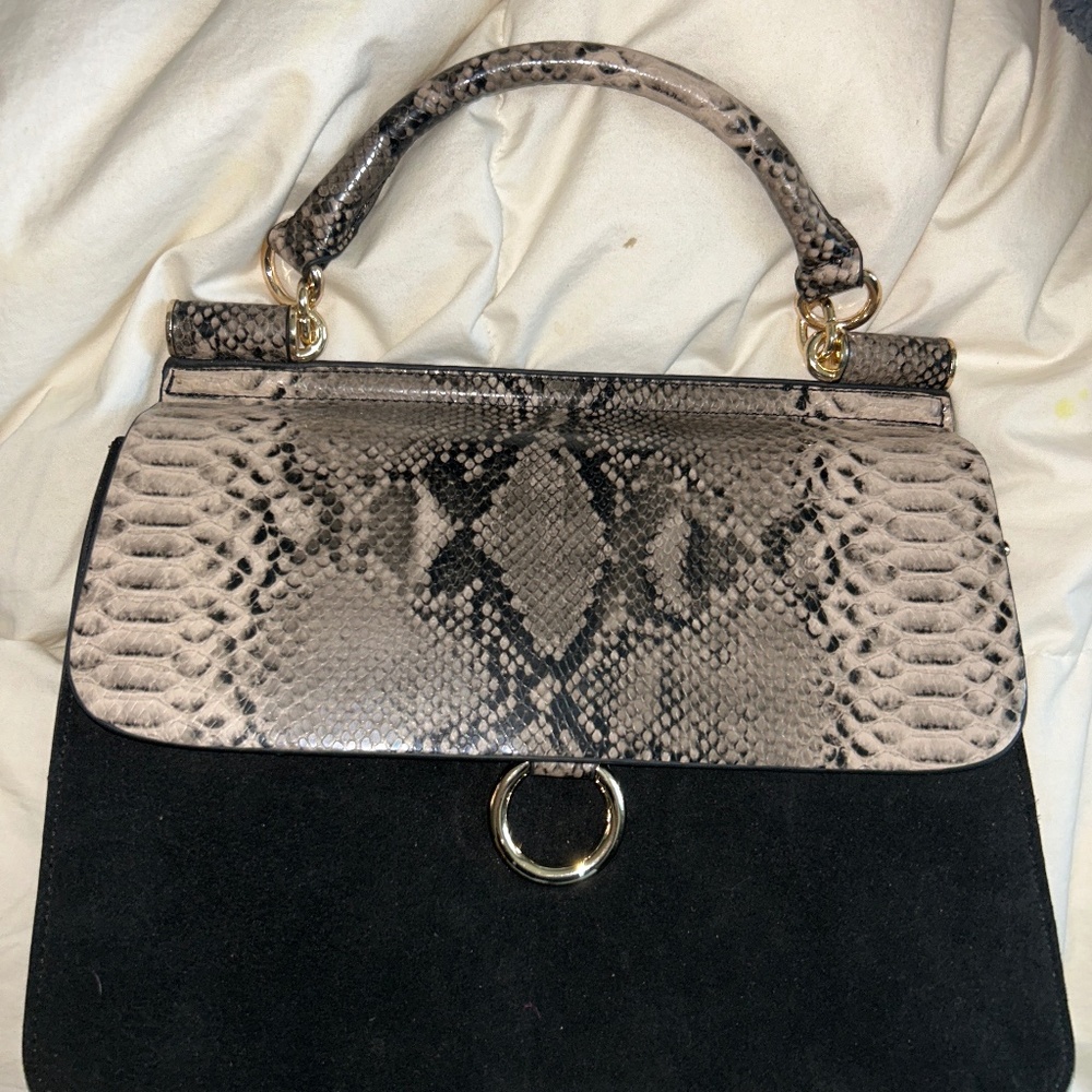Black and snake skin handbag